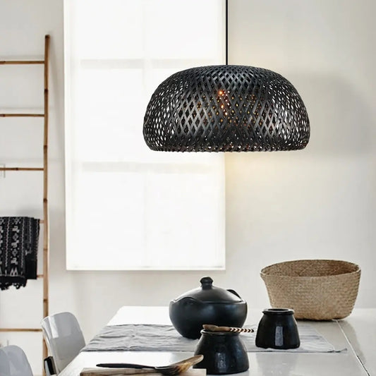 Eskil Black Bamboo hanging light over dining table