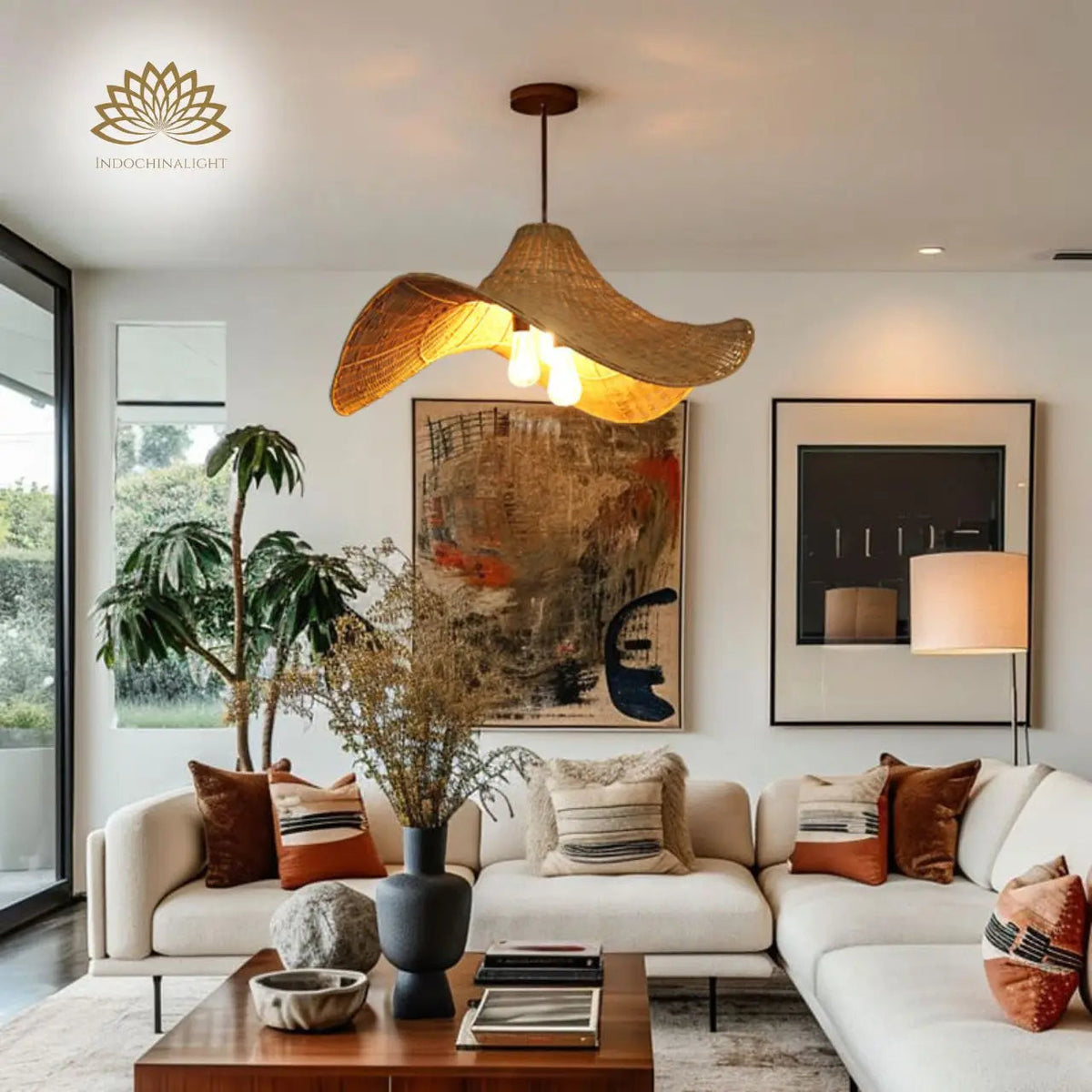 Selma Rattan Pendant Light in living room, large wave shade reading as a sculptural centerpiece with open weave throwing ambient shadow across the ceiling