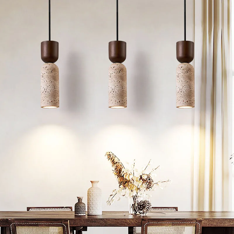 3 Auren Wabi Sabi Cylinder Stone and Wood Pendant Lights over dining table