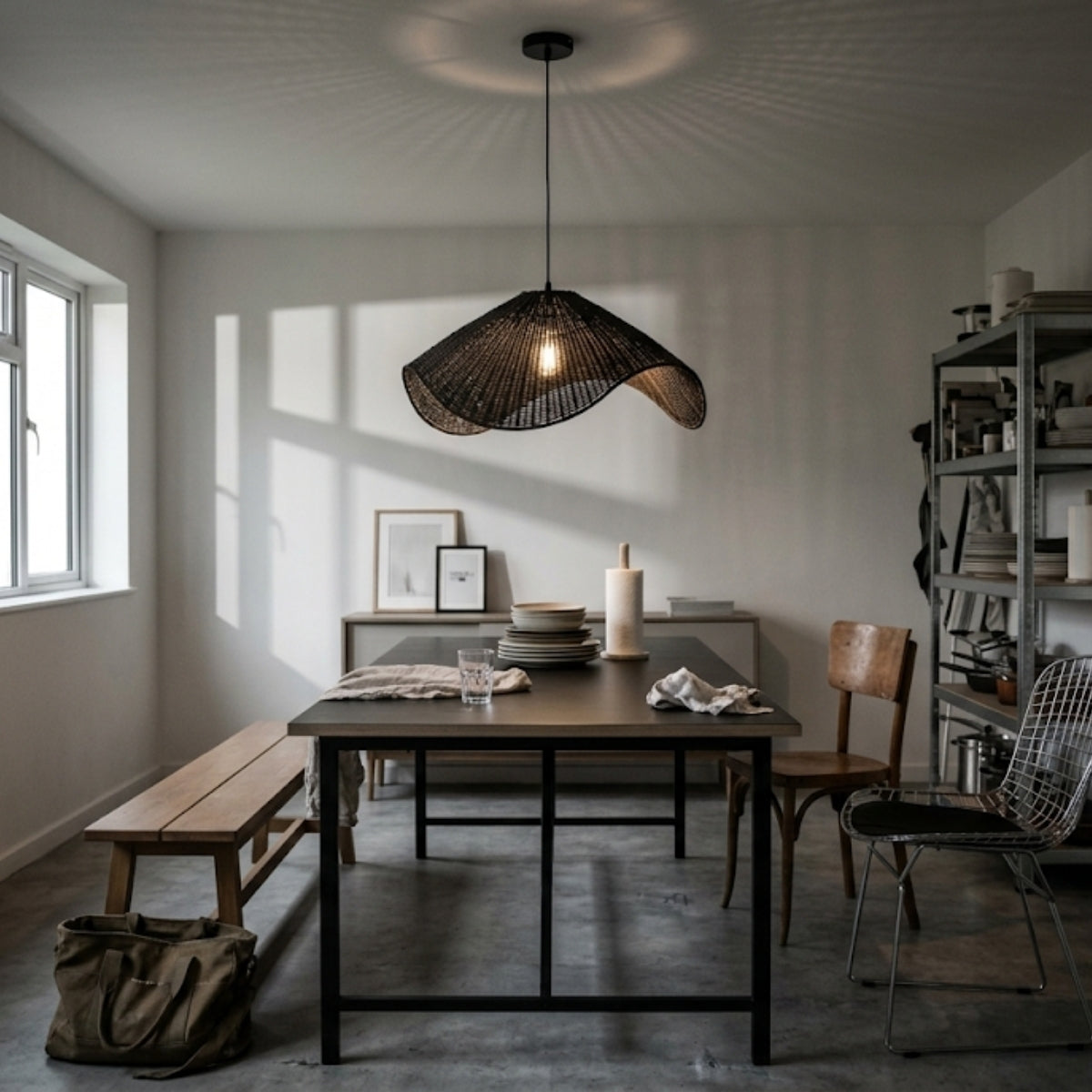 Adaya Black Wicker Rattan Pendant Light in dining room, large shade over the table casting soft light without glare across seated diners