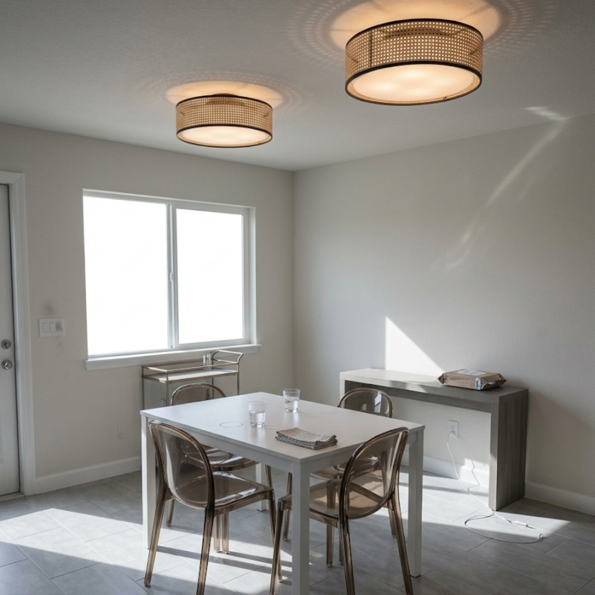 Alora Lyla Rattan Drum Flush Mount in dining room, drum covering the tabletop in soft perforated light without hot glare on plates