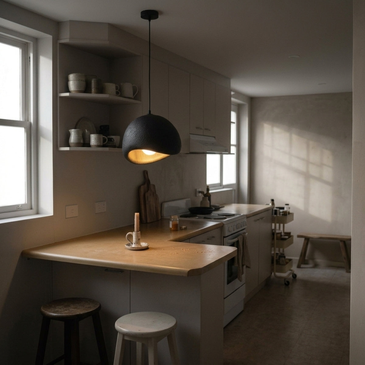 Amik Black Resin Pendant Light over kitchen island, clustered domes pooling light evenly across the surface with no hot spots while chopping