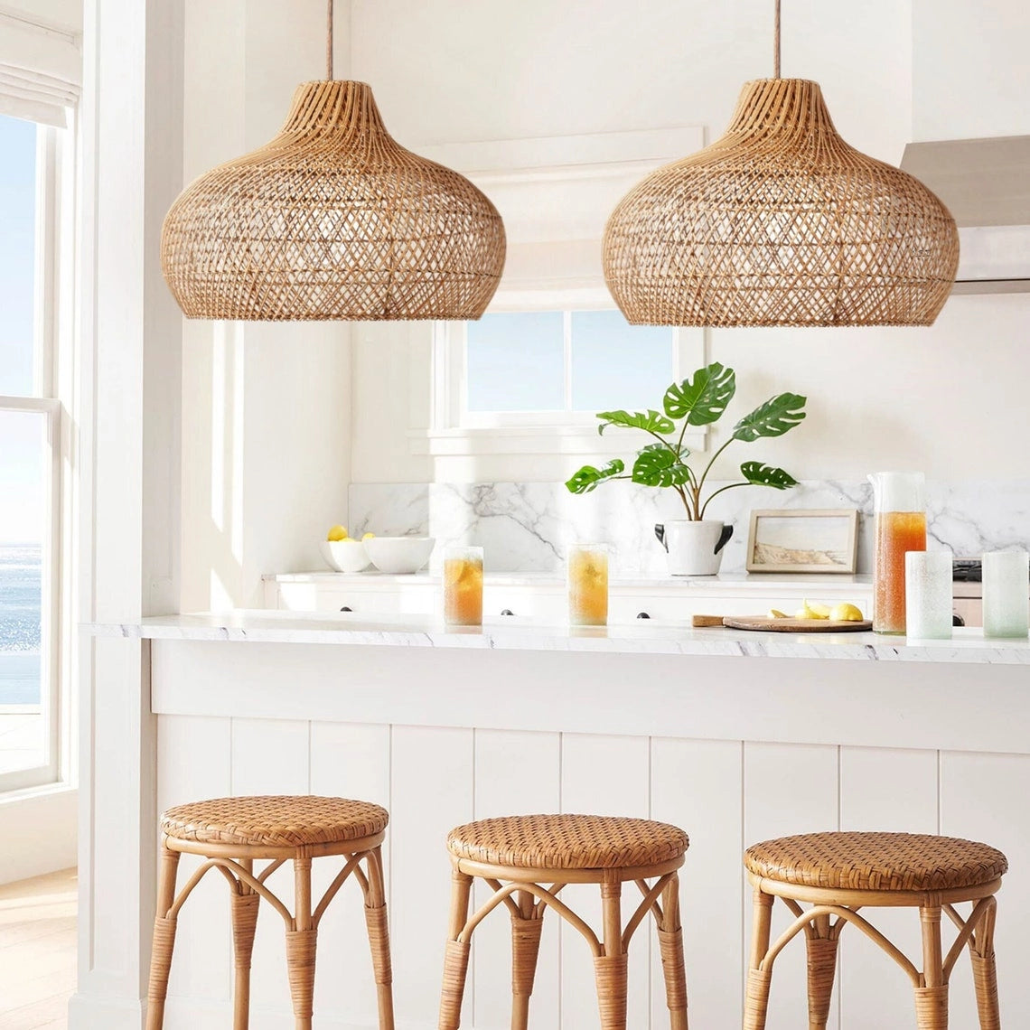 Anjani Dome Natural Rattan Pendant Light hanging on kitchen island