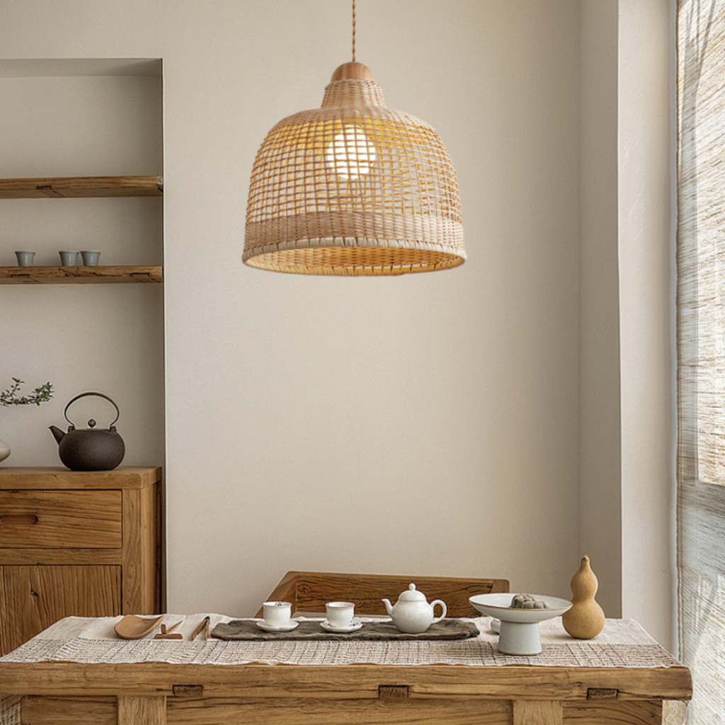Arturesthome rattan woven pendant light hanging over a dining table