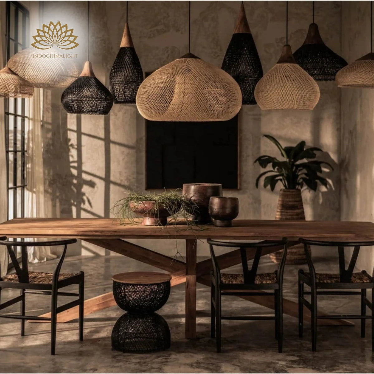 Bathari Wabi Sabi Rattan Pendant Light above dining table, wide bell dome covering a six-seat table while its open lattice keeps the shade visually light