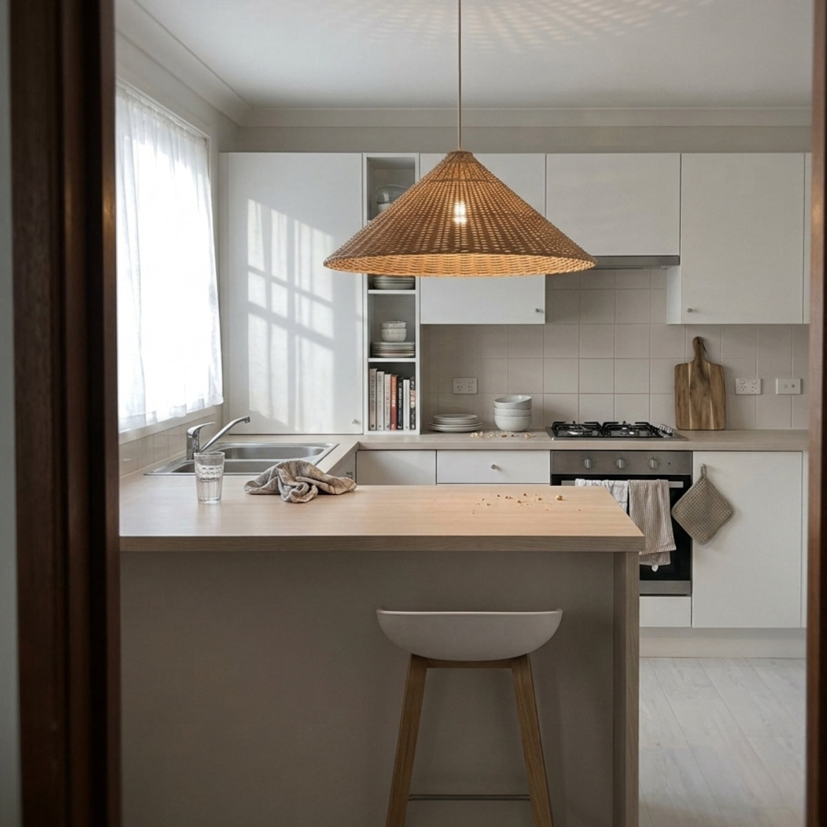 Carter Cone Woven Wicker Rattan Pendant Light over kitchen island, clustered cones spaced evenly for bright even coverage across the prep counter