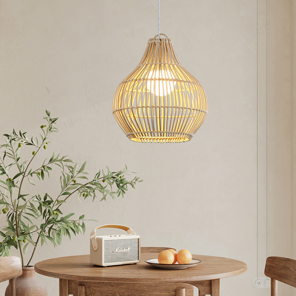 Dari rattan pendant light hanging over a wooden dining table