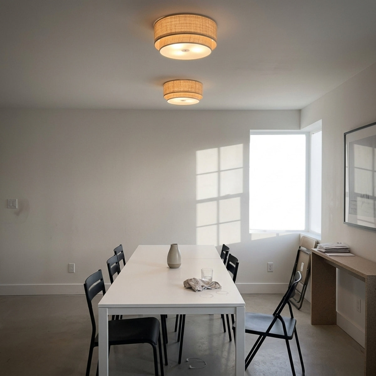 El Corte Drum Round Wicker Light Flush Mount above dining table, flush jute drum covering a six-seat table evenly without glare or hanging drop