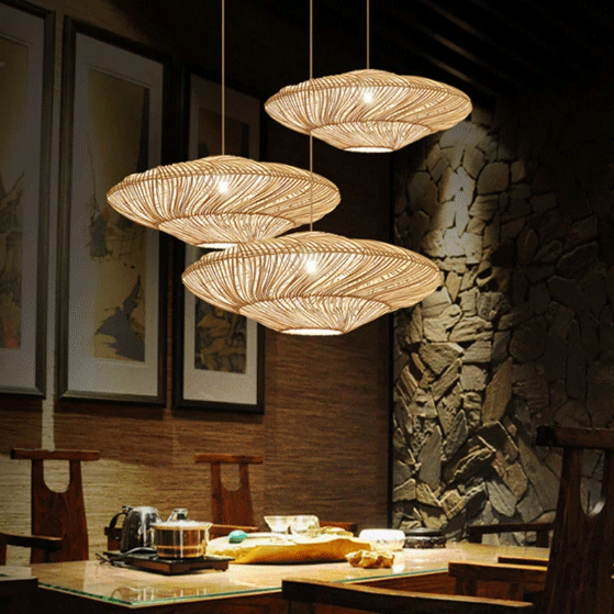 Flying Saucer Woven Rattan Pendant Lamps hanging above dining table
