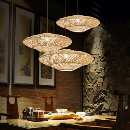 Flying Saucer Woven Rattan Pendant Lamps hanging above dining table