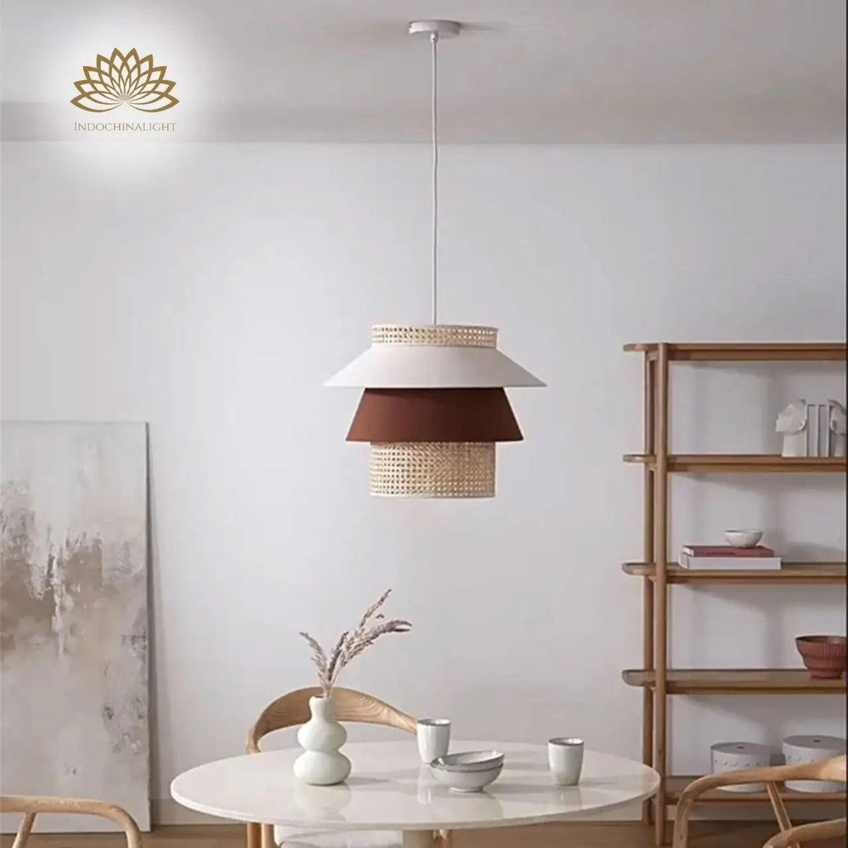Lampa Tiered Rattan Pendant in dining room, mid-size tiers center over the table, spreading open woven light across the surface without glare