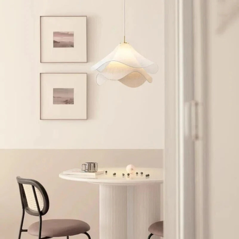 Lia Wabi Sabi Fabric Pendant Light in dining room, mid-size cone covering the table, hand-pleated fabric filtering the bulb rather than exposing it at eye level