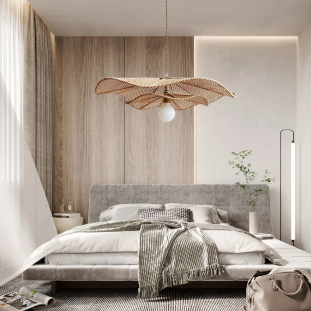 Lotus Leaf Rattan Pendant Light in bedroom, compact shade working as a bedside pendant, open weave keeping light soft for reading and freeing the nightstand