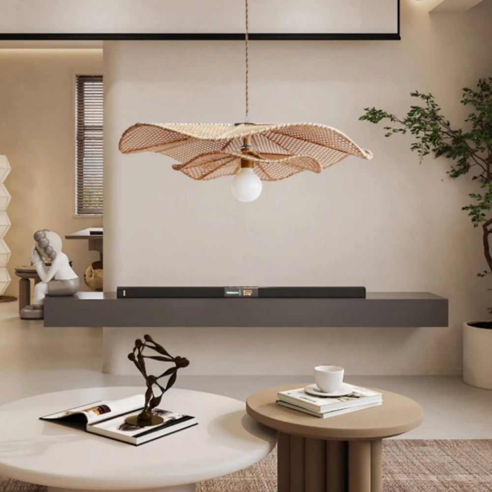 Lotus Leaf Rattan Pendant Light in living room, largest shade reading as a centerpiece over the coffee table, open lattice casting patterns across the ceiling