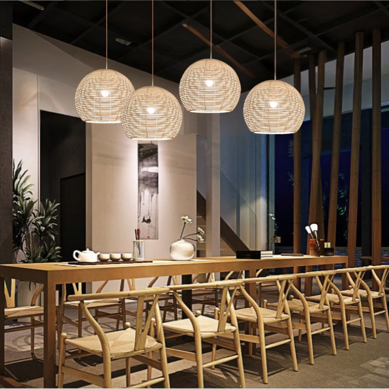 Manor Brook Verona Rattan Pendant Lights hanging above dining table