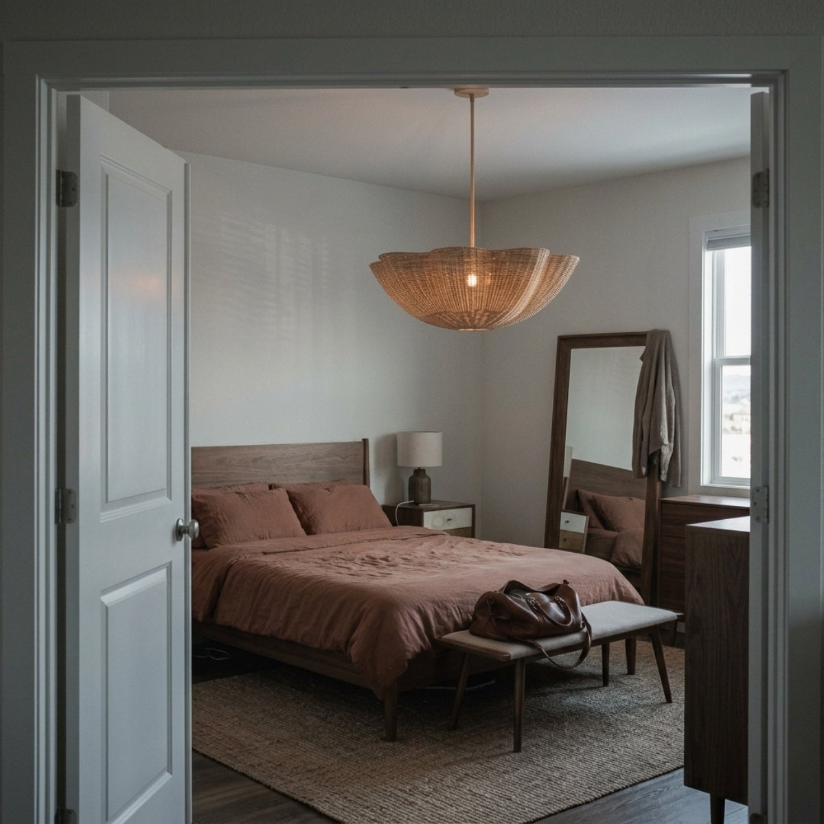 Marion Scallop Woven Wicker Rattan Pendant in bedroom, scalloped shade hung low beside the bed filtering a soft glow for late evenings