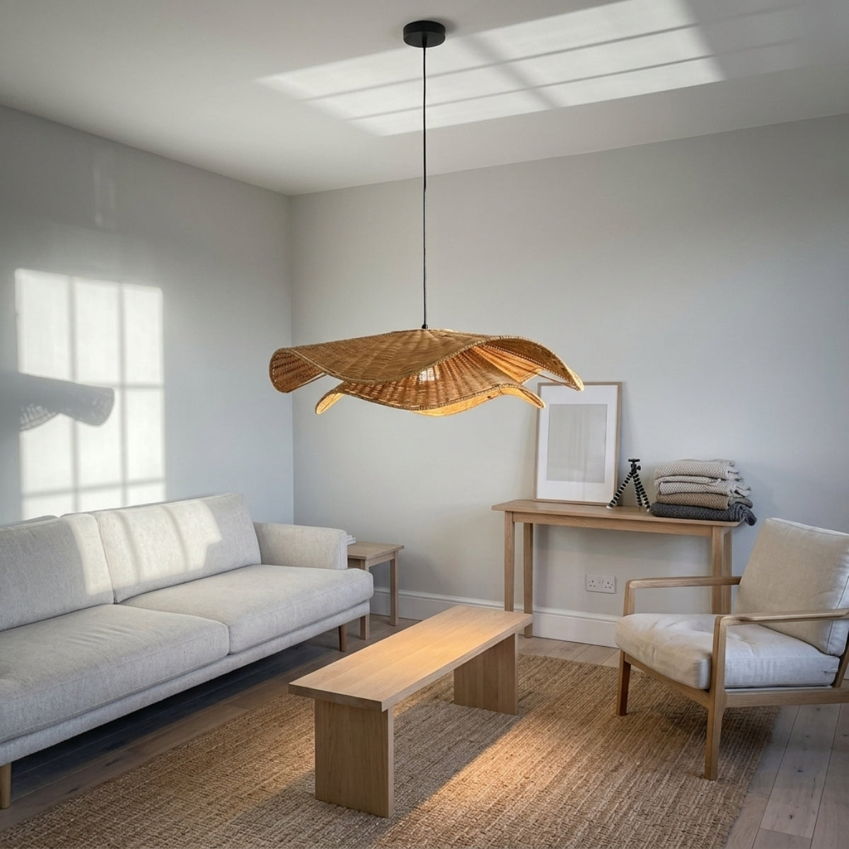 Nina Campbell Natural Velero Wicker Rattan Pendant in living room, 31.5-inch shade a centerpiece casting soft open-weave shadow patterns over the seating