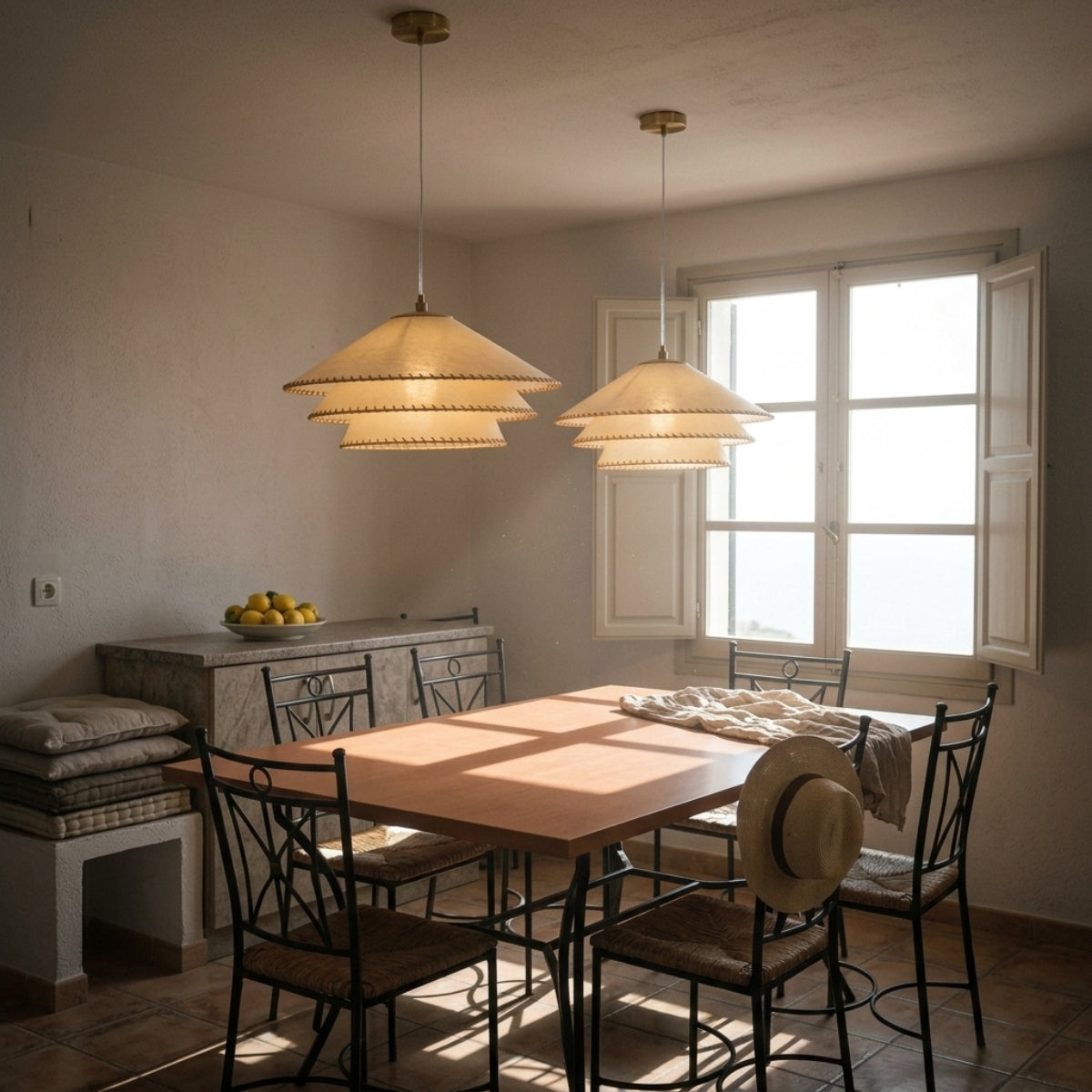 Planas Wabi Sabi Tiered Pendant Light above dining table, medium 19.7-inch parchment tiers glowing low enough for warmth without glare across place settings