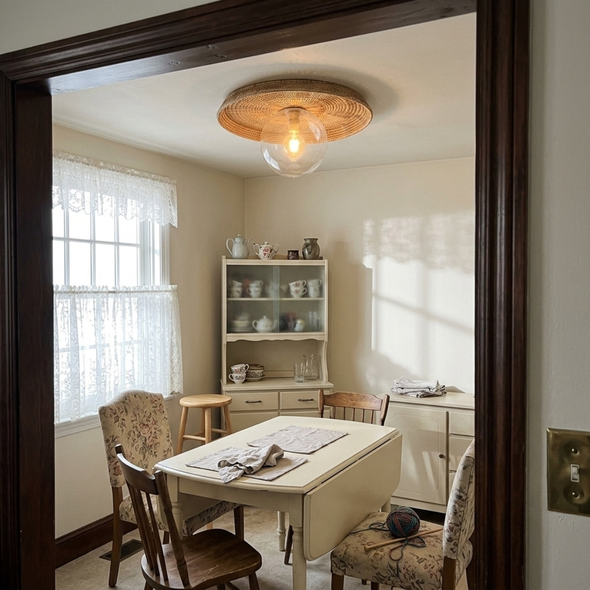 Plato Boho Rattan Ceiling Flush Mount above dining table, flush sunburst disc leaving clearance on an 8-foot ceiling while spreading even glare-free light