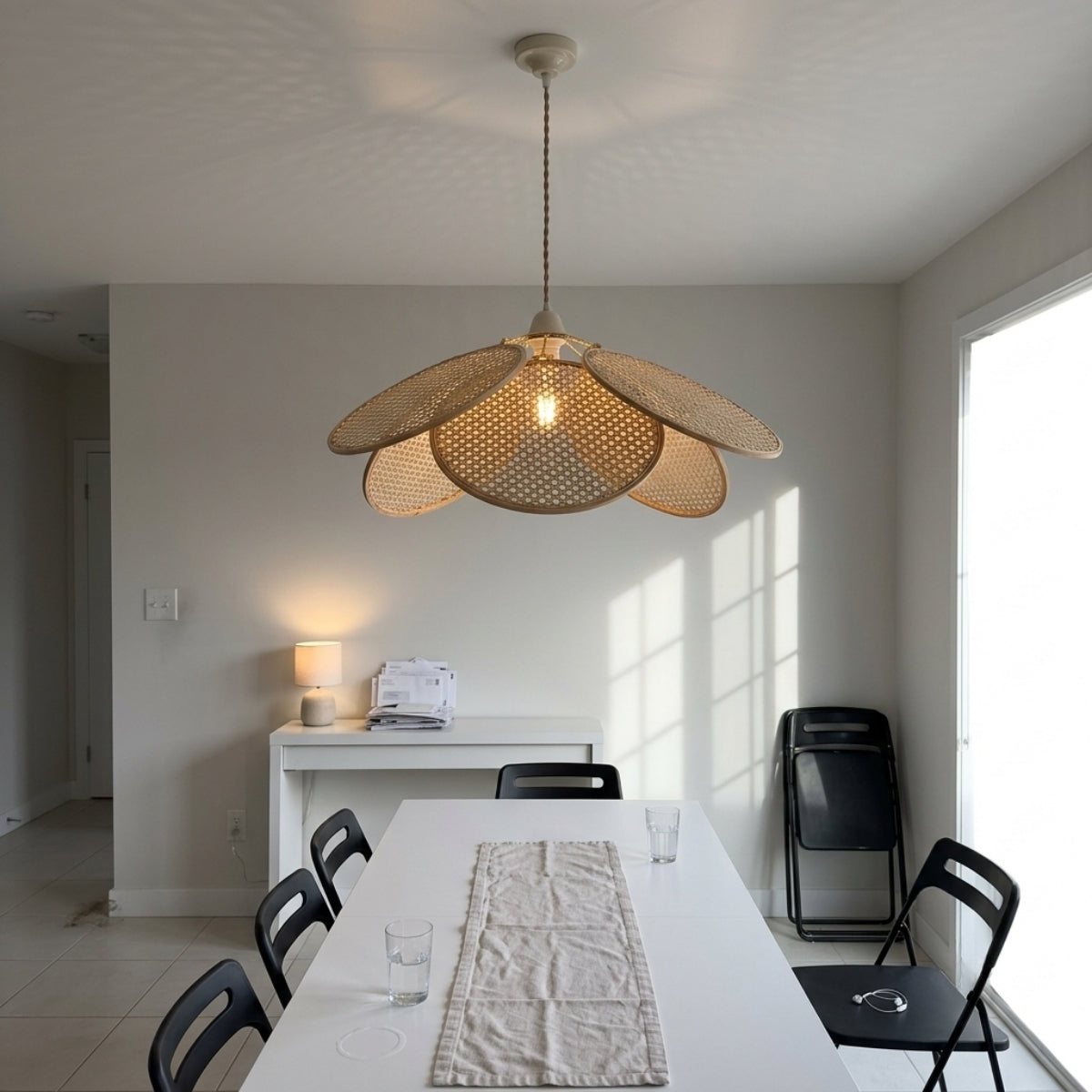 Ritta French Country Rattan Pendant Light in dining room, bloom centered over the table spreading honey-amber light across its length without glaring into seated eyes