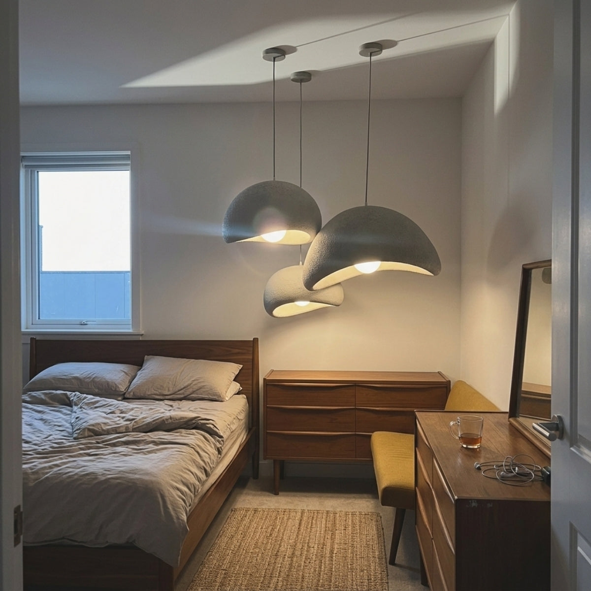 Shibui Wabi Sabi Pendant Light in bedroom, small resin shell hung beside the bed keeping its low dome glow close and out of your eyeline