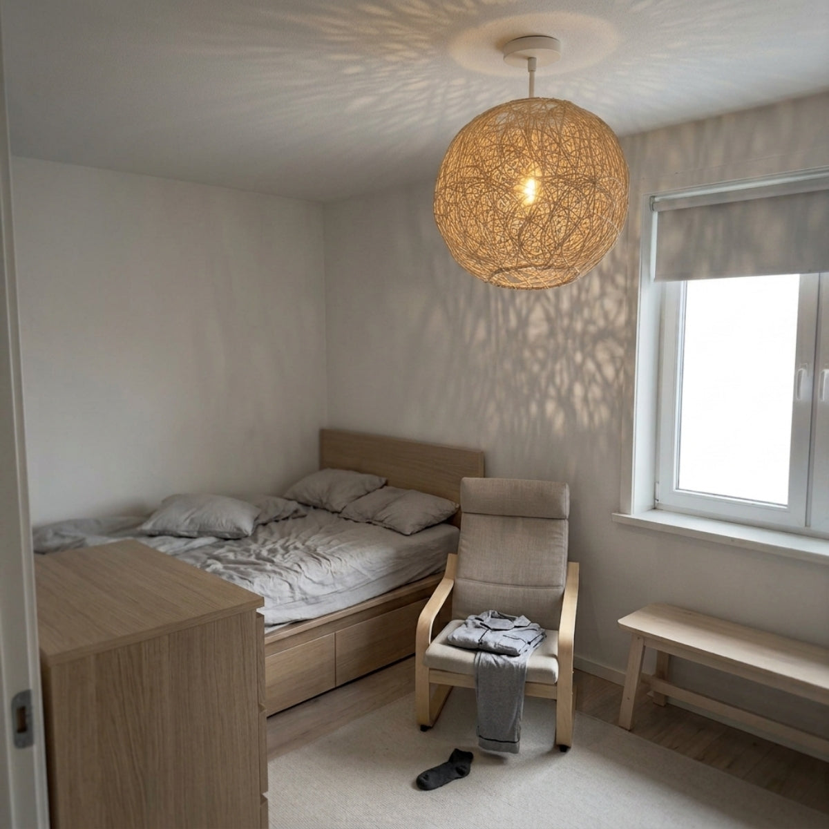 Sucada Round Rattan Ceiling Light Fixture in bedroom, compact cocoon sphere beside the bed, dense weave softening light for late evening reading