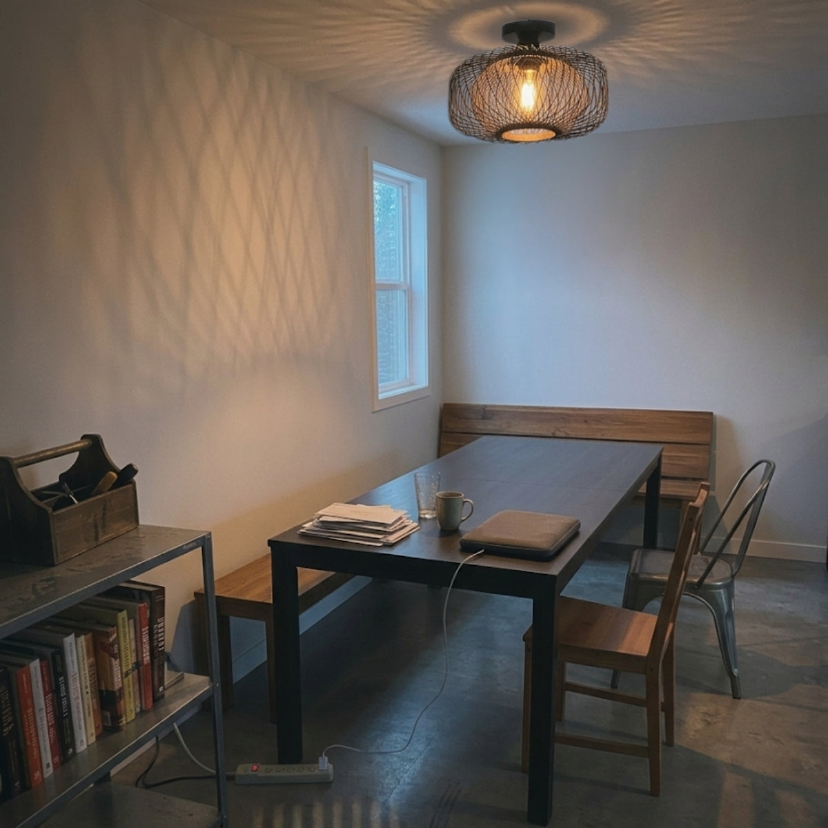 Tbaoinla Black Rattan Ceiling Light 16 Inches above dining table, black radial weave keeping glare off place settings while covering the tabletop below