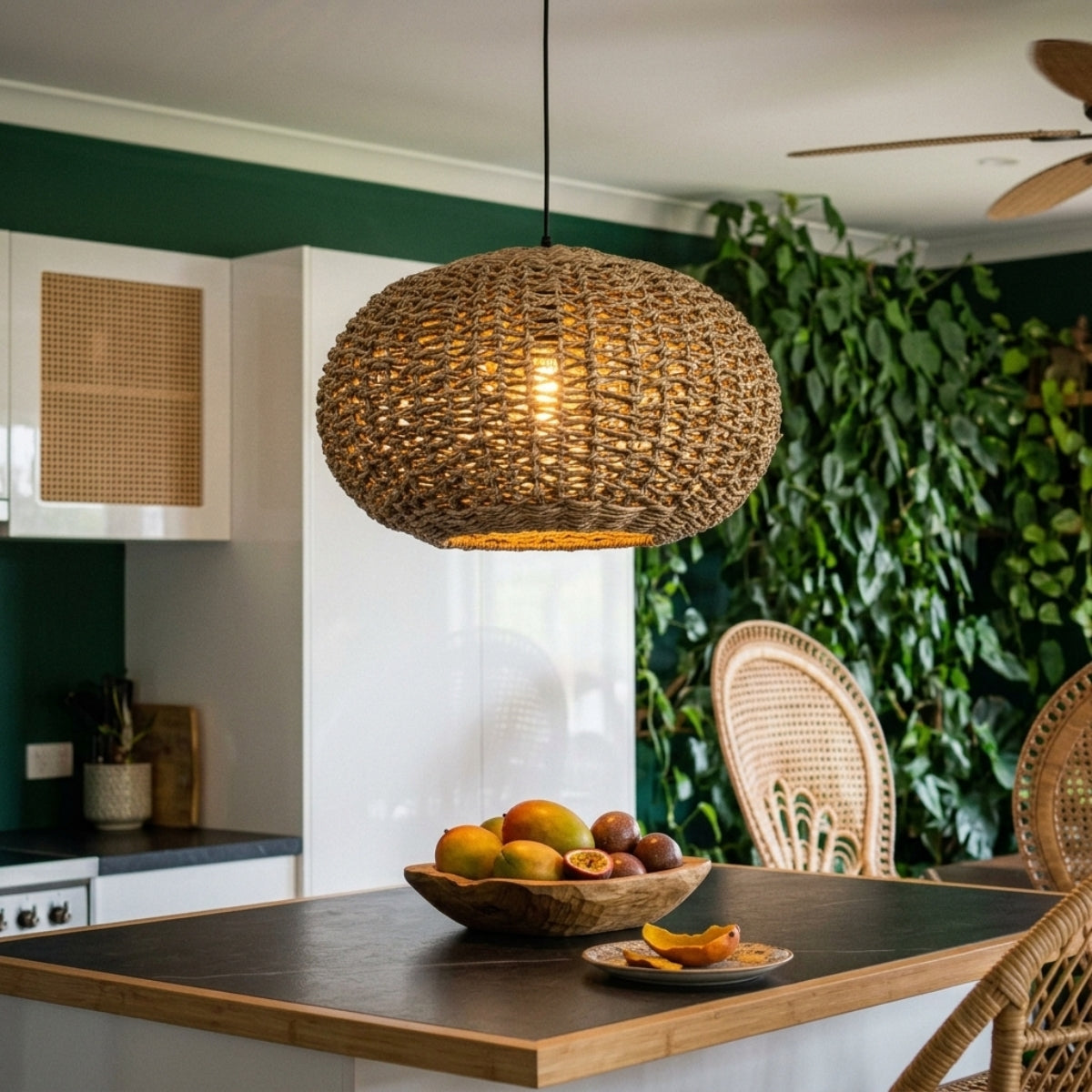 Teru Ji Kaikang Wicker Pendant over kitchen island, three small jute globes spaced evenly with open weave breaking up glare on the countertop