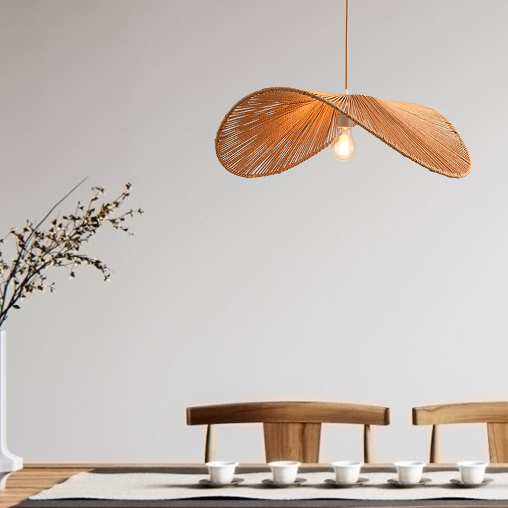 Wabi Sabi Hemp Rope Pendant in dining room, 23.6-inch shade breaking the bulb into soft hemp-woven patterns on the ceiling above the table
