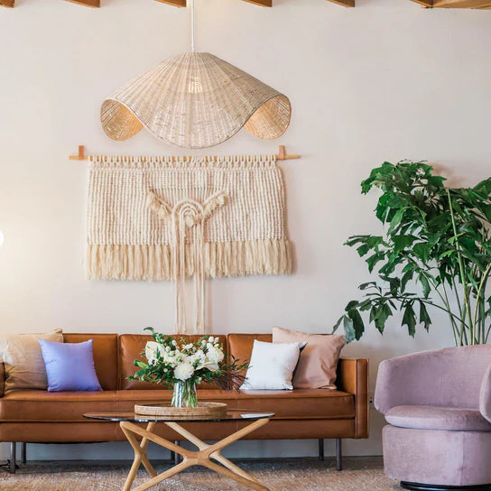 Adaya White Rattan Hanging Light hanging in a Rustic room