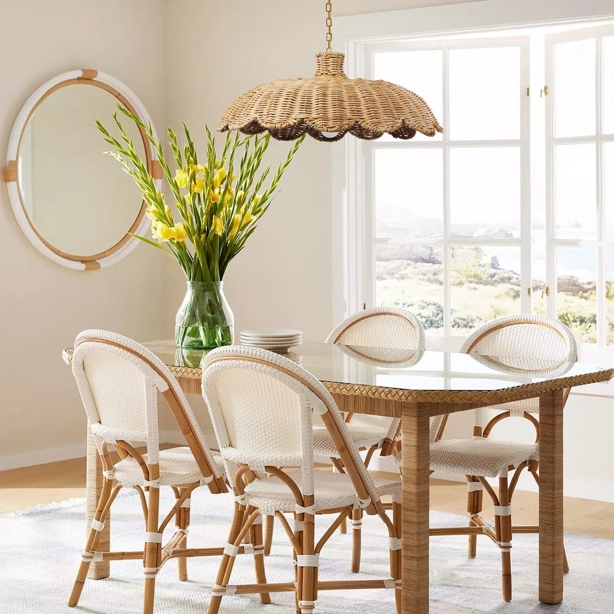 Alice scallop rattan pendant light hangs over Boho Dining Table