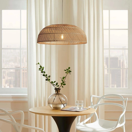Amara Dome Rattan Pendant Light hangs over a Boho Dining table