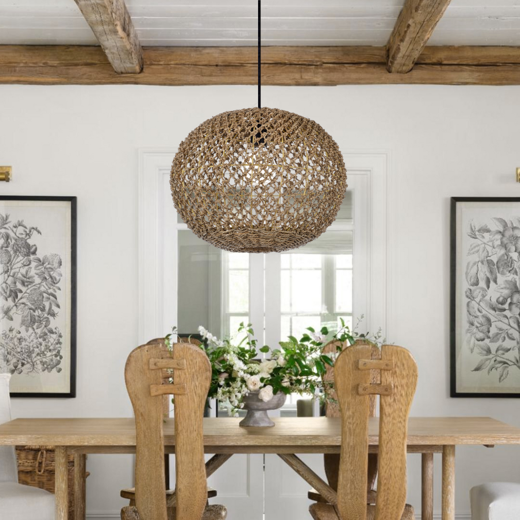 Antigua Flat Round Wicker Pendant Light hangs over wooden dining table