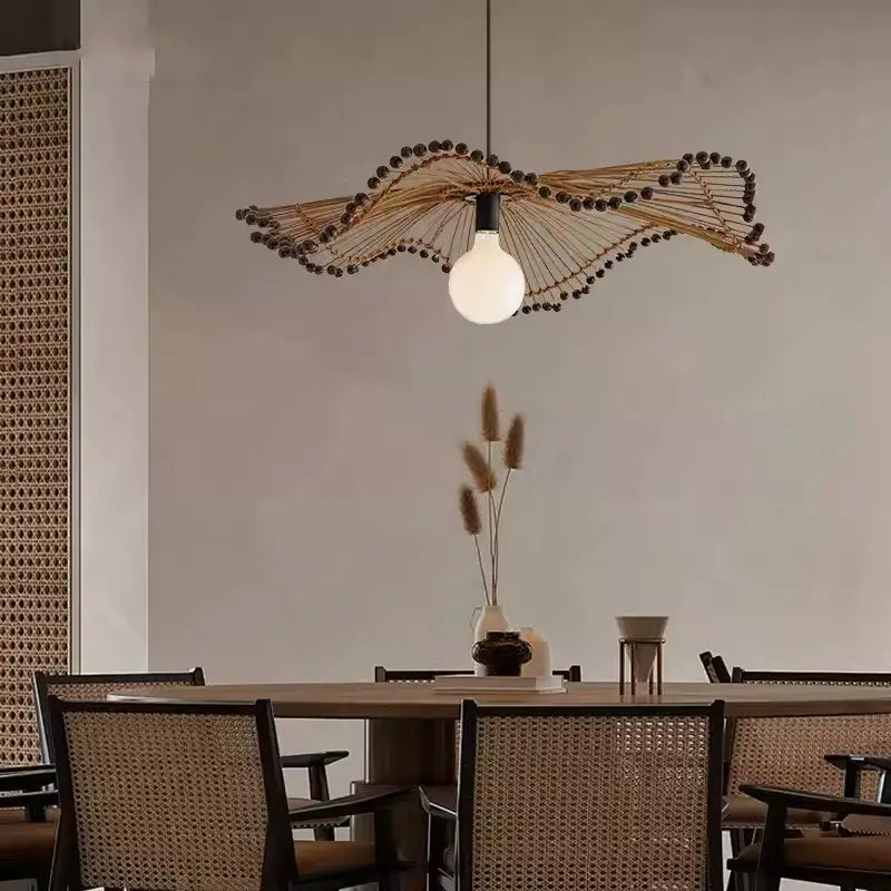 Arteriors Waverly Brown Rattan Light hanging over the dining table