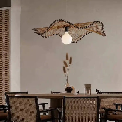 Arteriors Waverly Brown Rattan Light hanging over the dining table