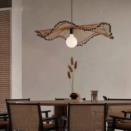 Arteriors Waverly Brown Rattan Light hanging over the dining table