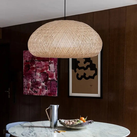 Bemith Beige Oval Bamboo Pendant Light above a zen-style table