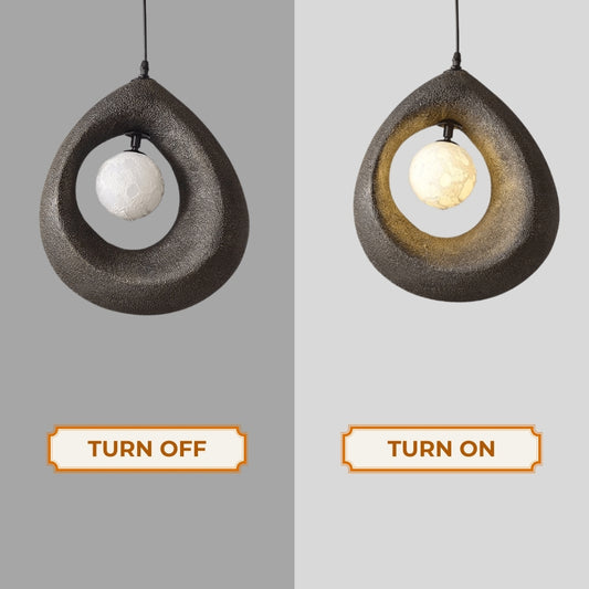 black wabi sabi cave surround ball pendant light when the light is on and off
