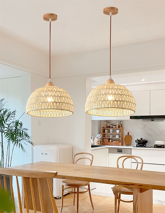 Campana Small White Rattan Basket Pendant Lights hang over a minimalist Kitchen Island