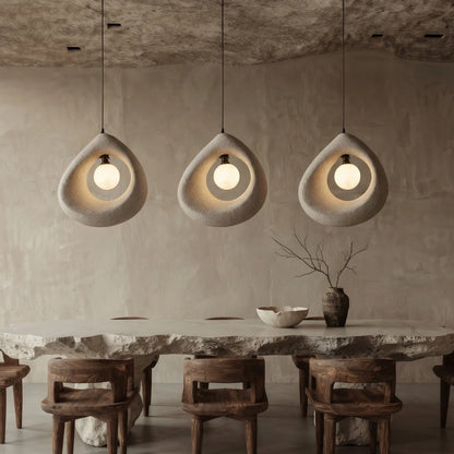 Cave Surround Pendant Lights Hang over Wabi Sabi Dining Room