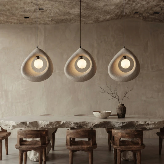 Cave Surround Pendant Lights Hang over Wabi Sabi Dining Room