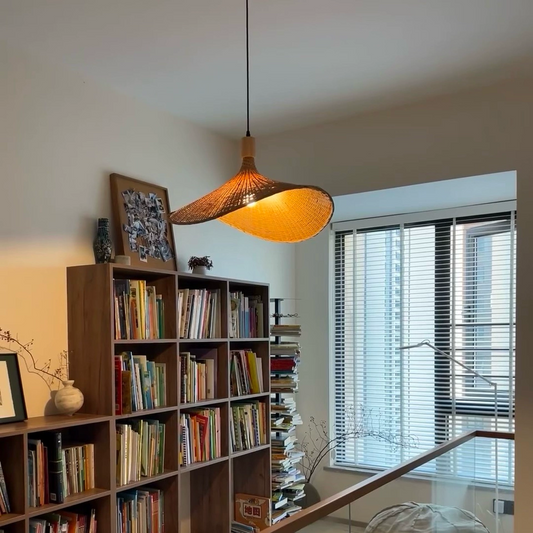 Ellie Hat 3 Light Rattan Pendant hangs over IndochinaLights Customer Home Library
