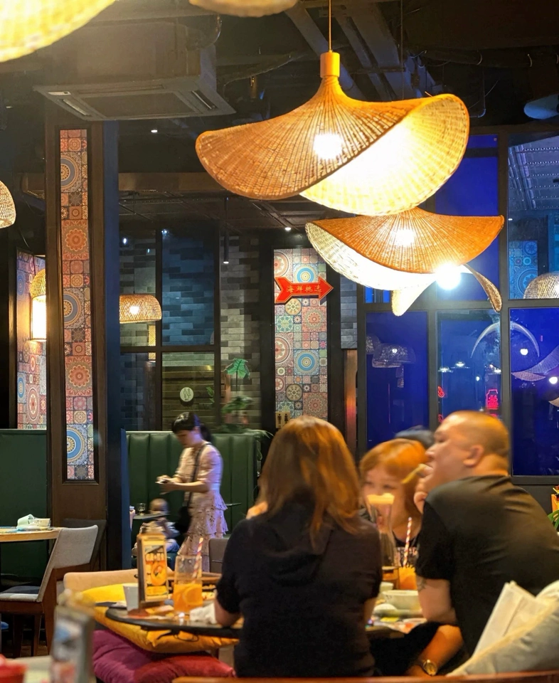 Ellie Hat Rattan 3 Light Pendant over IndochinaLights Customer Cafe Tables