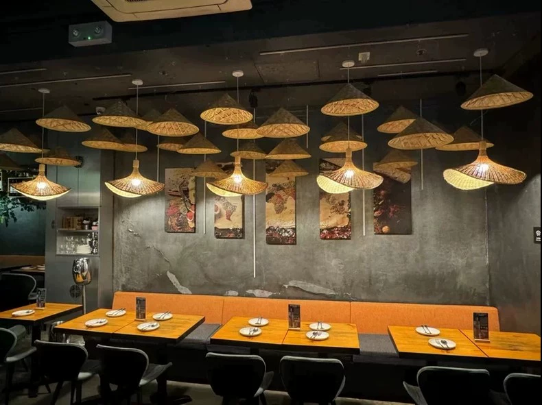 Ellie Hat Rattan 3 Light Pendants over IndochinaLights Customer Restaurant Tables