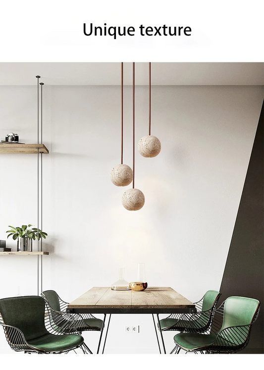 Fabien Wabi Sabi Globe Travertine Stone Pendant Light over Wooden Table