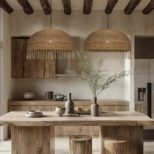 Frayed Rattan Dome Pendant Lights over Wabi Sabi Kitchen Island Table