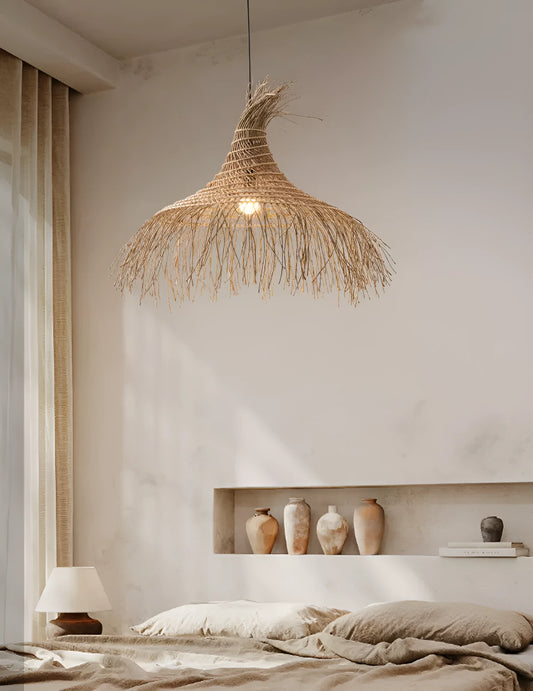 Large Pipa Tassel Rattan Pendant Light hangs over Wabi Sabi bedroom