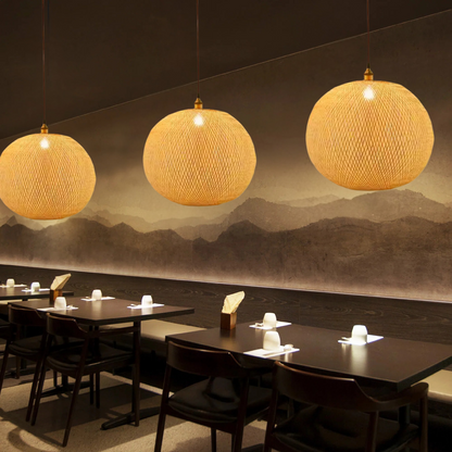 Lucy round bamboo pendant light over restaurant tables
