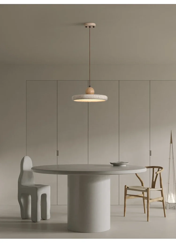 Mannelli Circular Travertine Stone Pendant Light in wabi sabi dining room