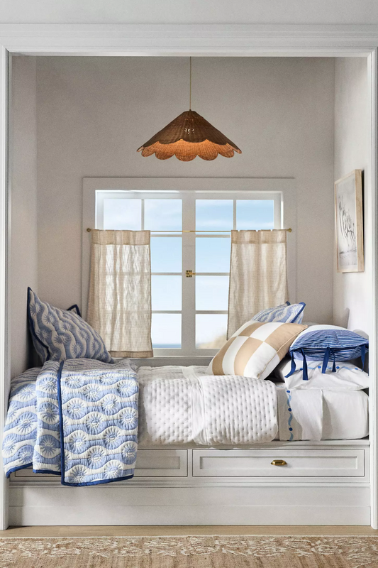 Maude Scallop Rattan Pendant Light over Coastal Bedroom